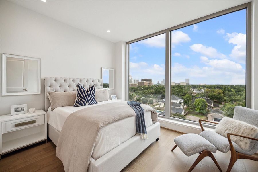 En-suite bedroom with floor-to-ceiling windows.