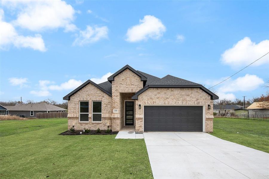 Front exterior of a new home in , Greenville, TX, highlighting curb appeal (Image 2). Front exterior of a new home in , Greenville, TX, highlighting curb appeal (Image 2).