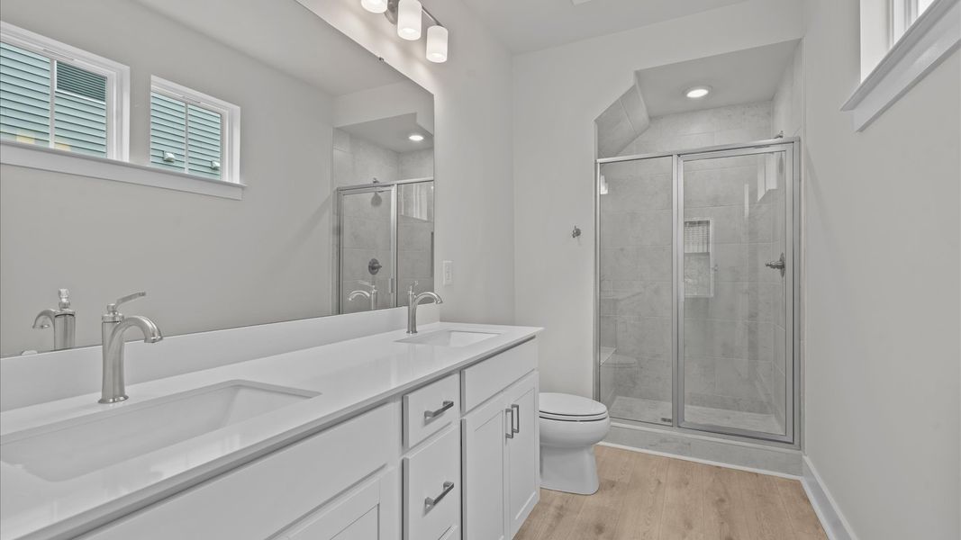 Luxe primary bathroom with double sink vanity in two story townhome at Aspen Ridge by DRB Homes in Lyman, SC Luxe primary bathroom with double sink vanity in two story townhome at Aspen Ridge by DRB Homes in Lyman, SC