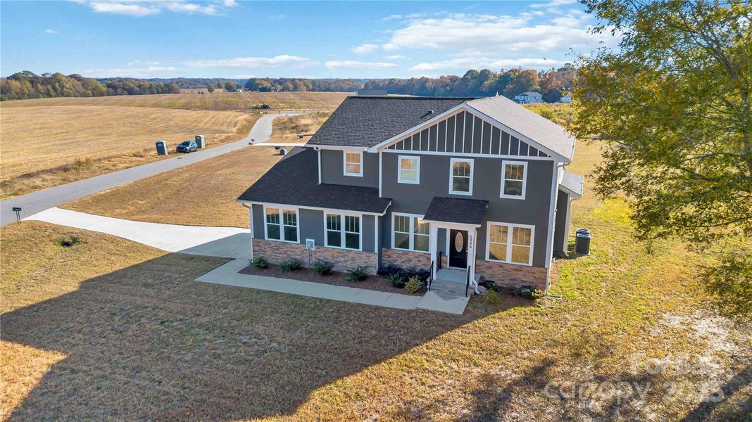 Front exterior of a new home in , Monroe, NC, highlighting curb appeal (Image 24). Front exterior of a new home in , Monroe, NC, highlighting curb appeal (Image 24).