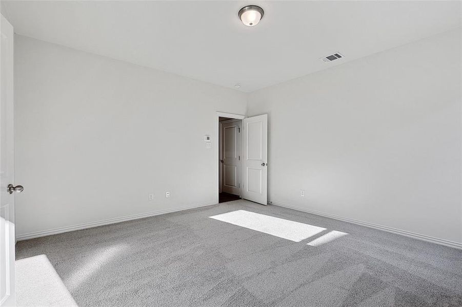 Empty room with carpet floors