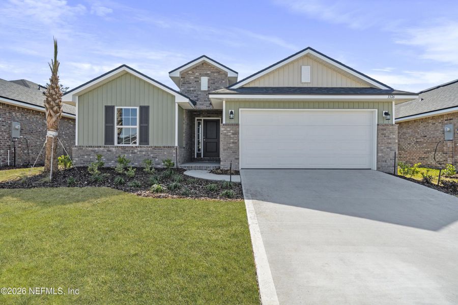 Front exterior of a new home in Shadow Crest at Rolling Hills, Green Cove Springs, FL, highlighting curb appeal (Image 16).