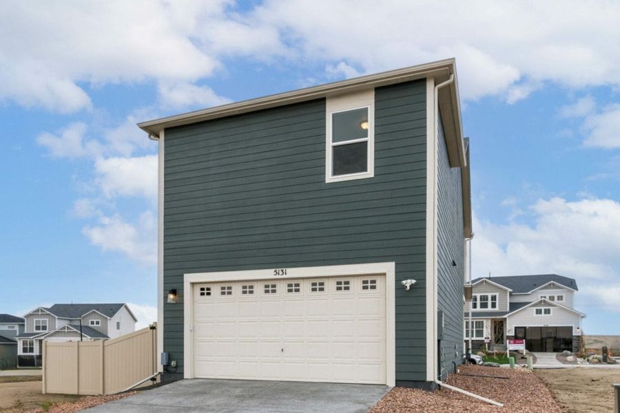 Front exterior of a new home in The Trails at Aspen Ridge – Altitude Collection, Colorado Springs, CO, highlighting curb appeal (Image 28). Front exterior of a new home in The Trails at Aspen Ridge – Altitude Collection, Colorado Springs, CO, highlighting curb appeal (Image 28).