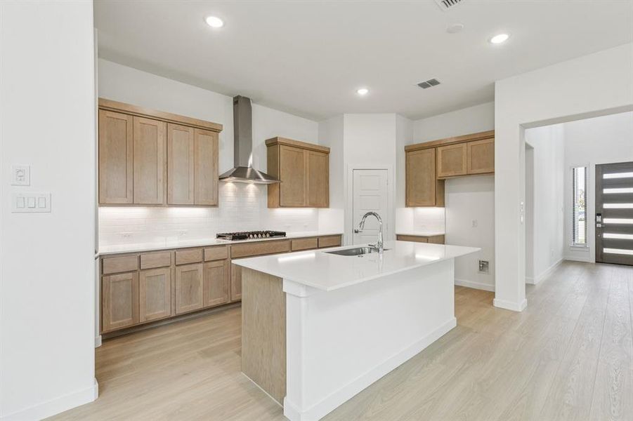 Kitchen in the Da Vinci II home plan by Trophy Signature Homes – REPRESENTATIVE PHOTO