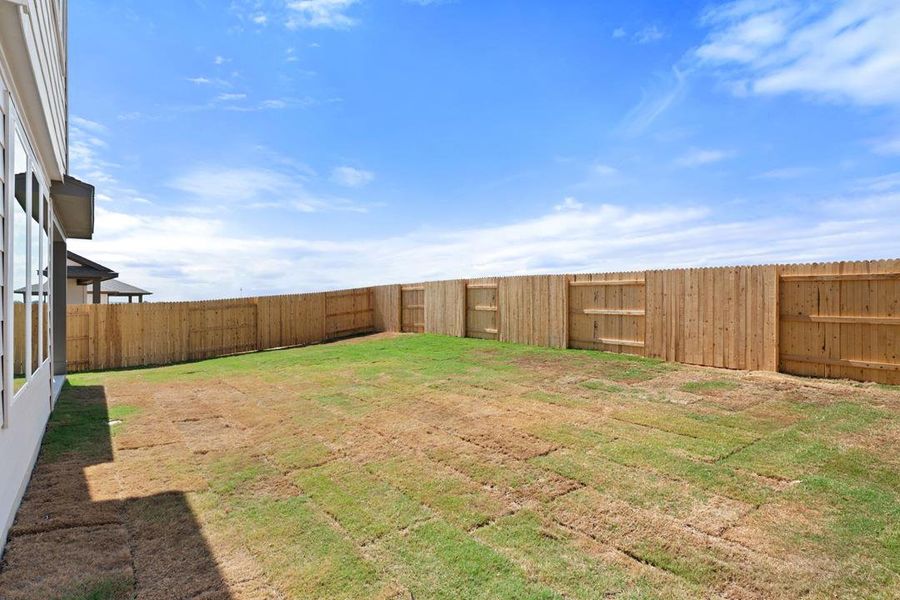 Exterior details and patio area of a home in Terrace Collection At Turner's Crossing, Buda (Image 21).