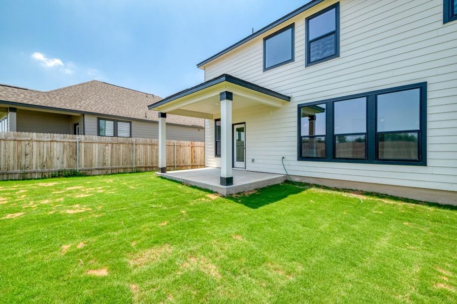 Exterior details and patio area of a home in Overlook Ranch, Georgetown (Image 18).