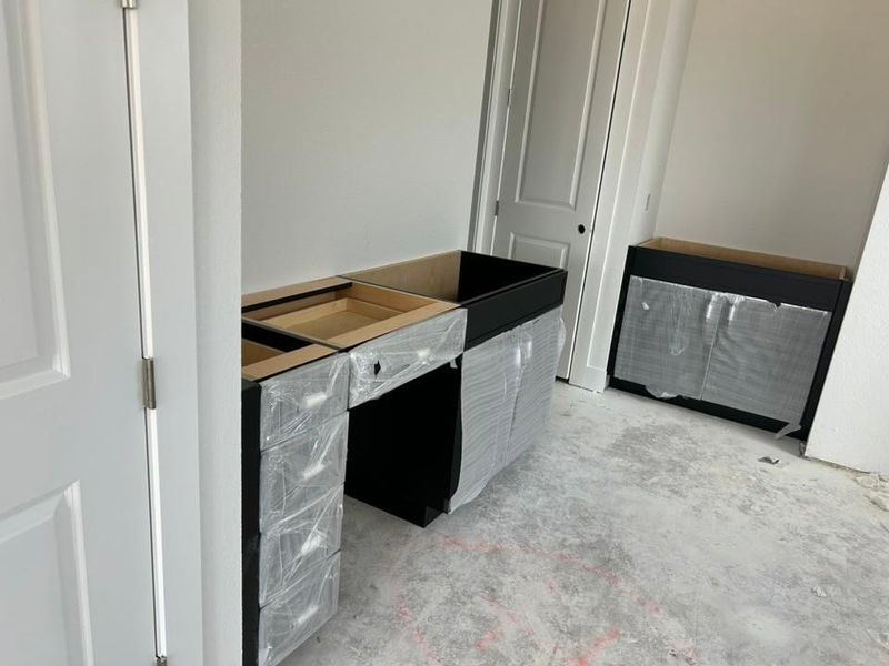 Kitchen with unfinished concrete flooring