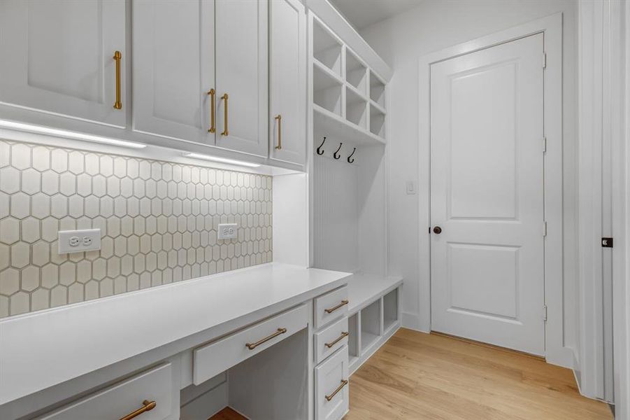 Mudroom with light wood finished floors