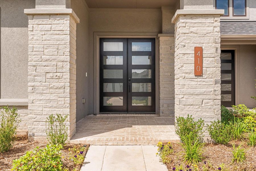 Covered front porch with welcoming entry.