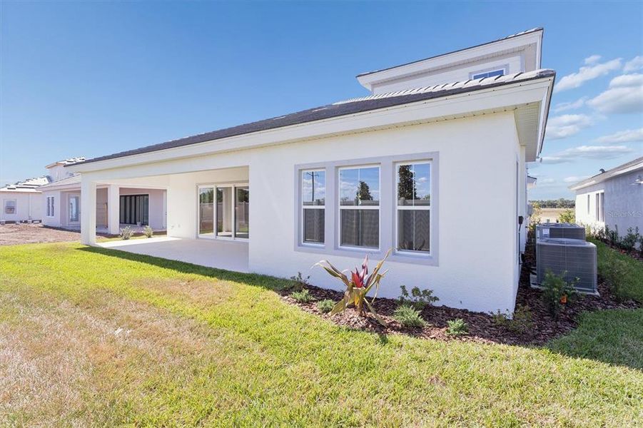 Exterior details and patio area of a home in Oakfield, Parrish (Image 3).