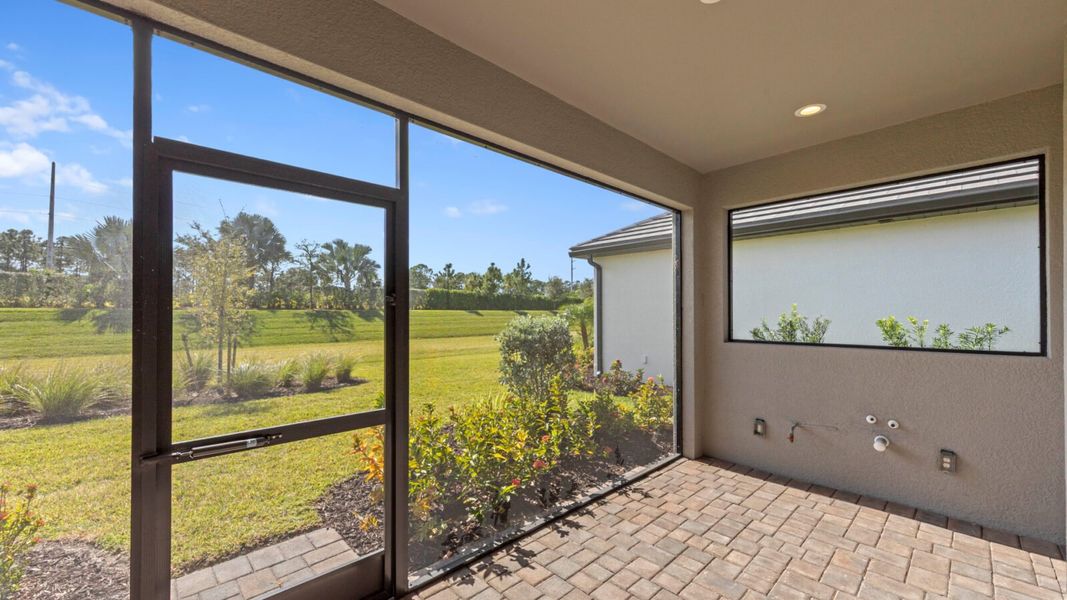 Exterior details and patio area of a home in SkySail, Naples (Image 19).