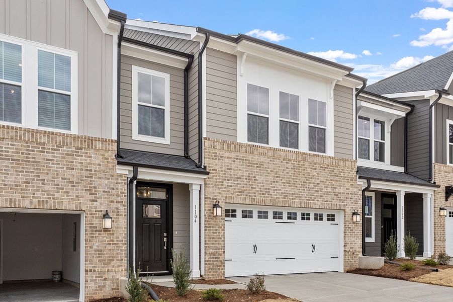 Exterior details and patio area of a home in Ovation at Sweetbrier, Durham (Image 3).