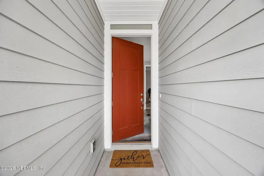 Exterior details and patio area of a home in Tributary, Yulee (Image 28).