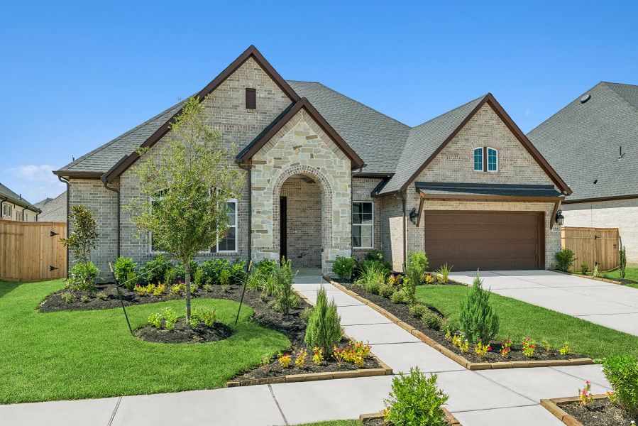 Front exterior of a new home in Sienna 65' Homesites, Missouri City, TX, highlighting curb appeal (Image 2).