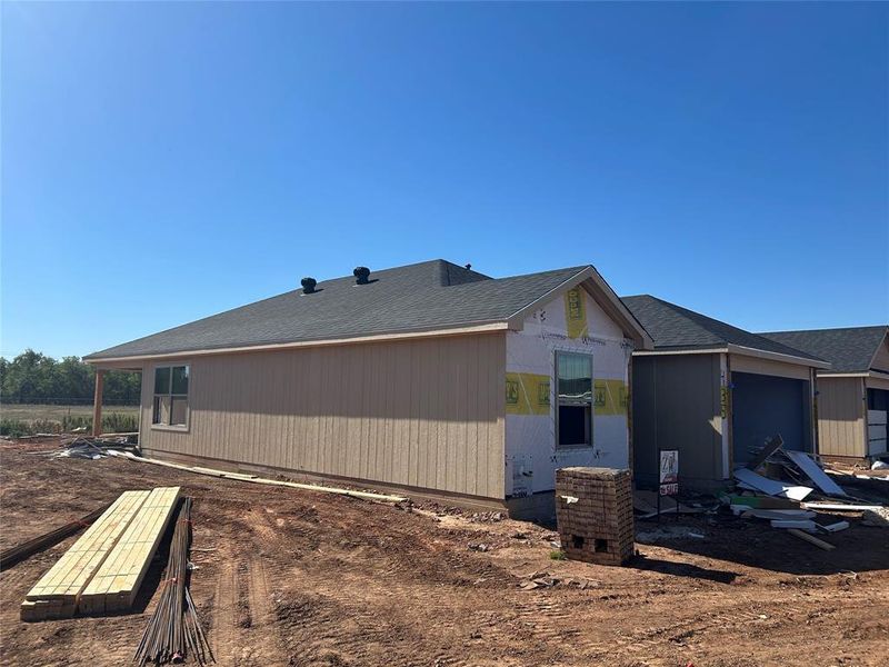 View of side of property with a shingled roof View of side of property with a shingled roof