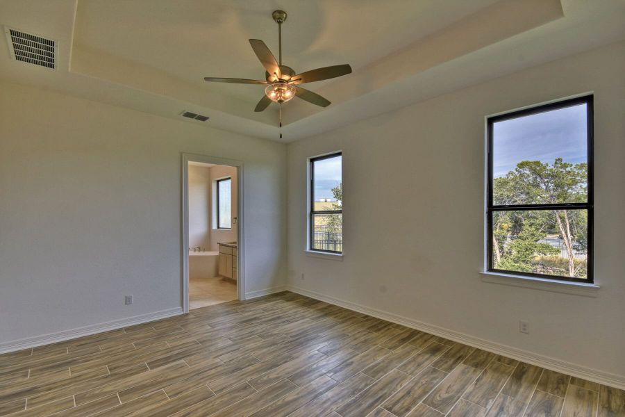 Spacious, unfurnished interior of a new home in El Sonido at Campanas, San Antonio (Image 28).