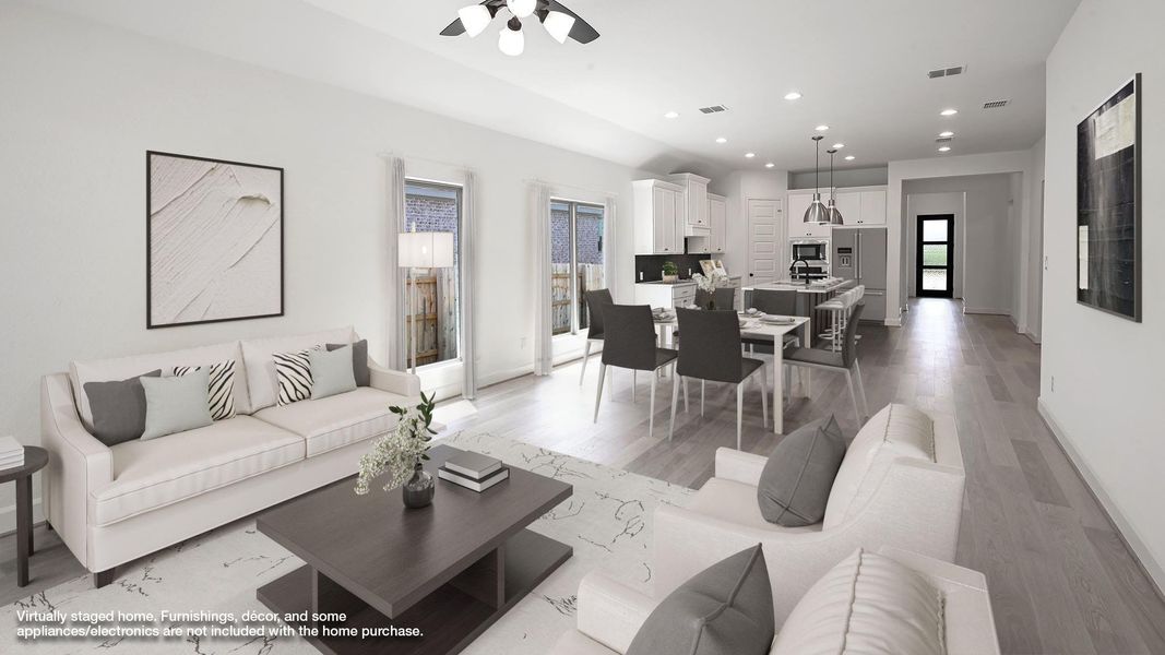 Living room featuring recessed lighting, light wood-style floors, and a ceiling fan Living room featuring recessed lighting, light wood-style floors, and a ceiling fan
