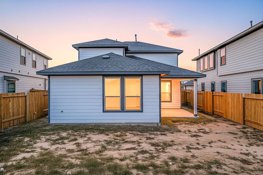 A spacious backyard with a covered patio, offering plenty of room for outdoor activities or future enhancements. The fenced-in yard provides privacy and a safe space to enjoy quiet evenings or host casual gatherings while taking in the warm glow of sunset views. A spacious backyard with a covered patio, offering plenty of room for outdoor activities or future enhancements. The fenced-in yard provides privacy and a safe space to enjoy quiet evenings or host casual gatherings while taking in the warm glow of sunset views.