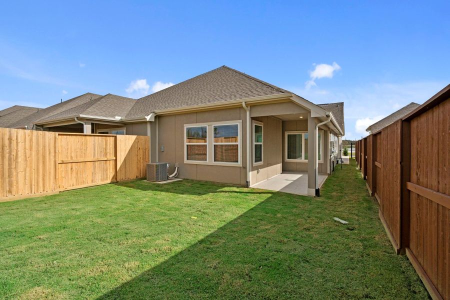 Exterior details and patio area of a home in Meridiana, Iowa Colony (Image 4).