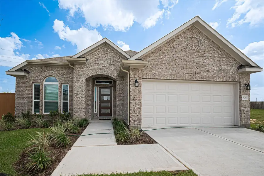 Front exterior of a new home in Rollingbrook Estates, Baytown, TX, highlighting curb appeal (Image 2). Front exterior of a new home in Rollingbrook Estates, Baytown, TX, highlighting curb appeal (Image 2).