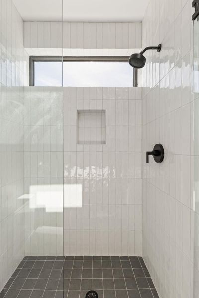 Bathroom featuring tiled shower