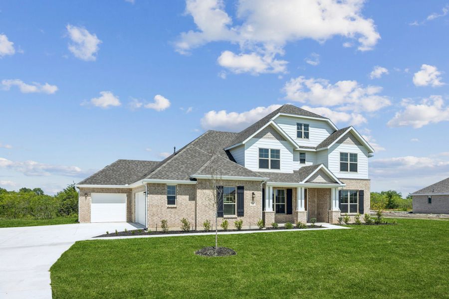 Front exterior of a new home in Ellis Ranch Estates, Waxahachie, TX, highlighting curb appeal (Image 20). Front exterior of a new home in Ellis Ranch Estates, Waxahachie, TX, highlighting curb appeal (Image 20).