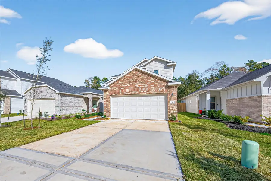 Front exterior of a new home in Woodland Lakes, Houston, TX, highlighting curb appeal (Image 22).