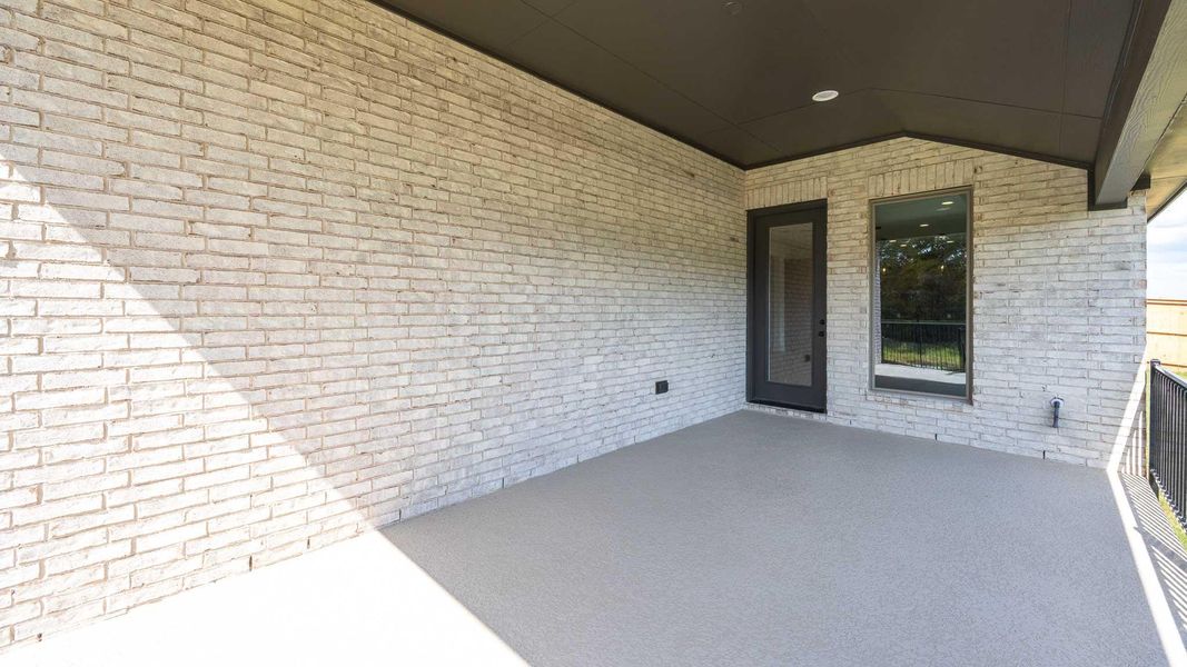 Exterior details and patio area of a home in The Colony, Bastrop (Image 4).
