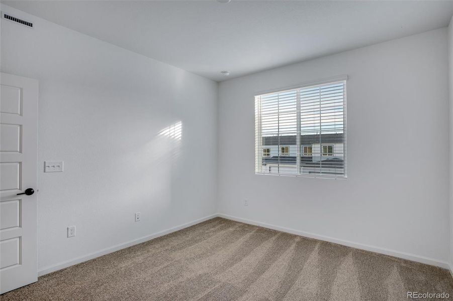 Spacious, unfurnished interior of a new home in Westside Crossing Townhomes, Berthoud (Image 24).