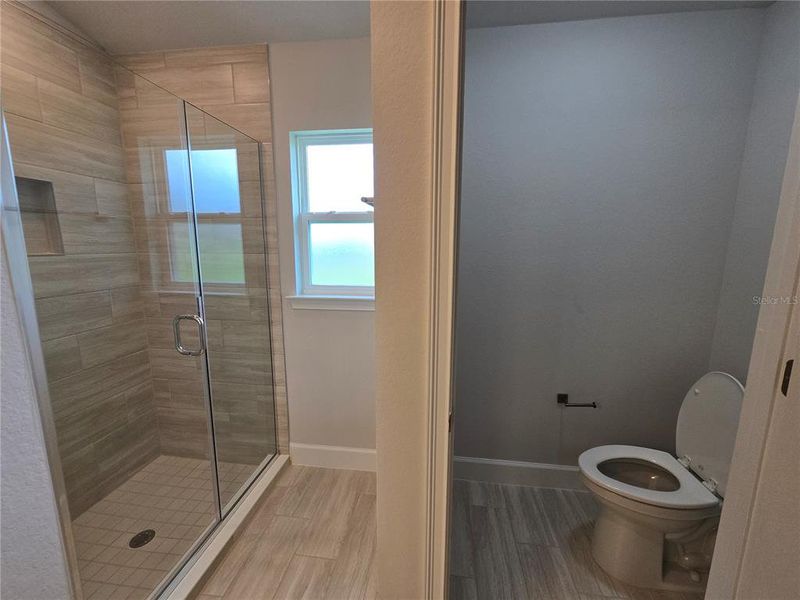 main bath tiled shower and water closet main bath tiled shower and water closet