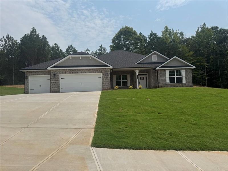 Front exterior of a new home in The Fields of Walnut Creek, Pendergrass, GA, highlighting curb appeal (Image 1). Front exterior of a new home in The Fields of Walnut Creek, Pendergrass, GA, highlighting curb appeal (Image 1).