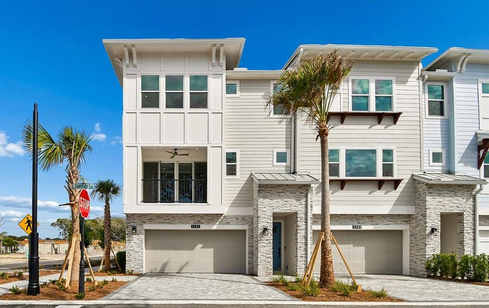 Front exterior of a new home in EvenTide, New Smyrna Beach, FL, highlighting curb appeal (Image 1). Front exterior of a new home in EvenTide, New Smyrna Beach, FL, highlighting curb appeal (Image 1).