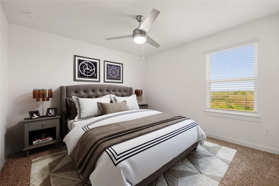 This secondary bedroom features high ceilings, ceiling fan, custom paint, plush carpet, walk-in closet and a large window with privacy blinds! *Virtually Staged