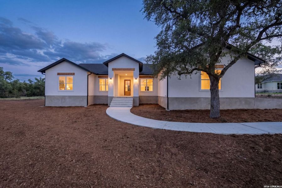 Front exterior of a new home in , Spring Branch, TX, highlighting curb appeal (Image 28).