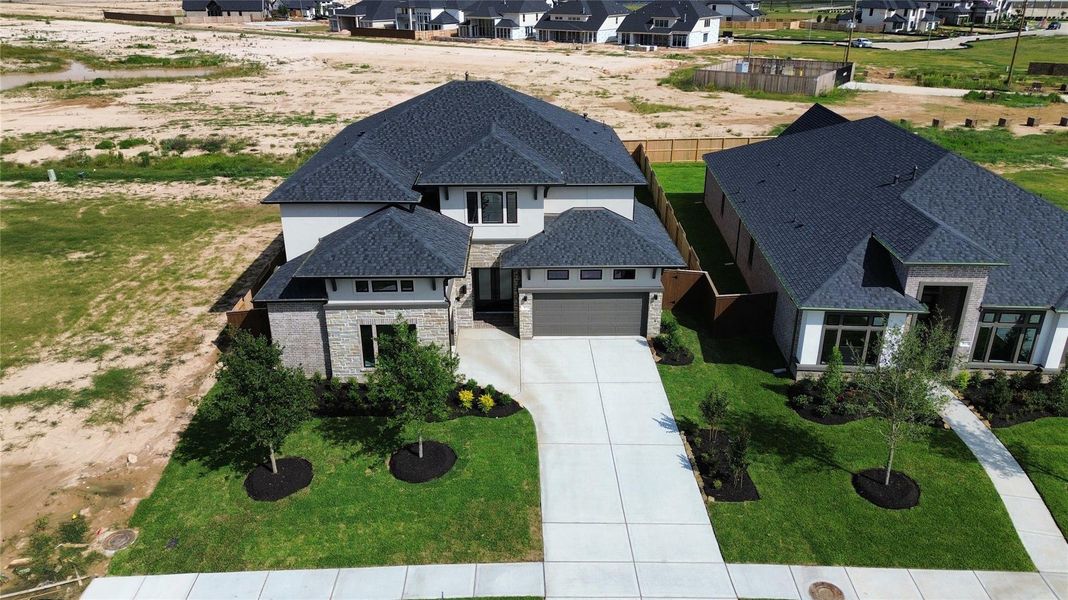 Front exterior of a new home in Legacy Prairie at Katy Court 65' & 70', Katy, TX, highlighting curb appeal (Image 21).
