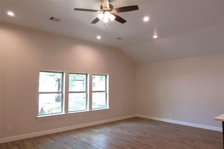 View of living room area with high 11ft ceilings and recessed lighting.