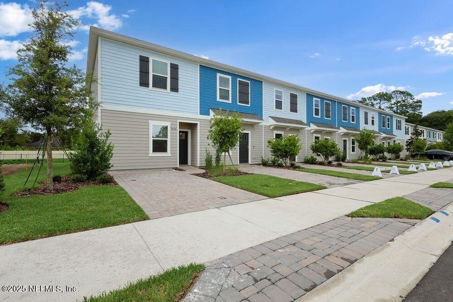 Front exterior of a new home in Sabal Terrace, Jacksonville, FL, highlighting curb appeal (Image 17).