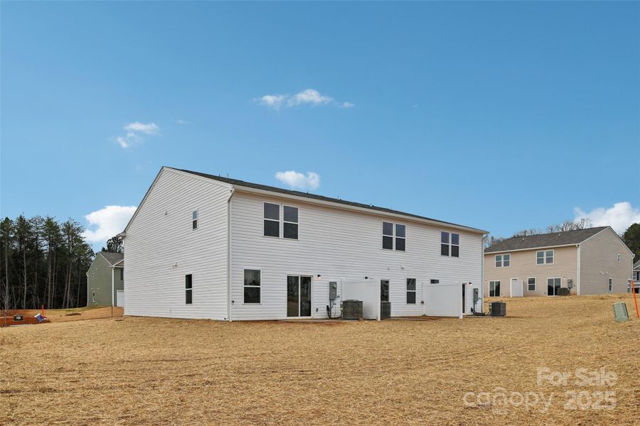 Exterior details and patio area of a home in The Towns at Green Needles, Lexington (Image 8).