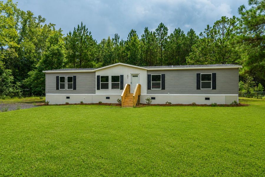 Exterior details and patio area of a home in , Cottageville (Image 37).