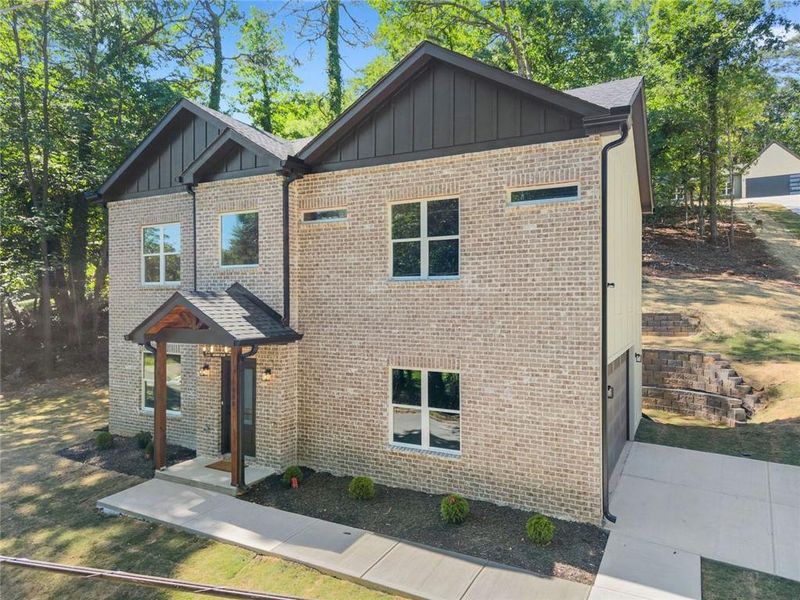 Front exterior of a new home in , Gainesville, GA, highlighting curb appeal (Image 21).