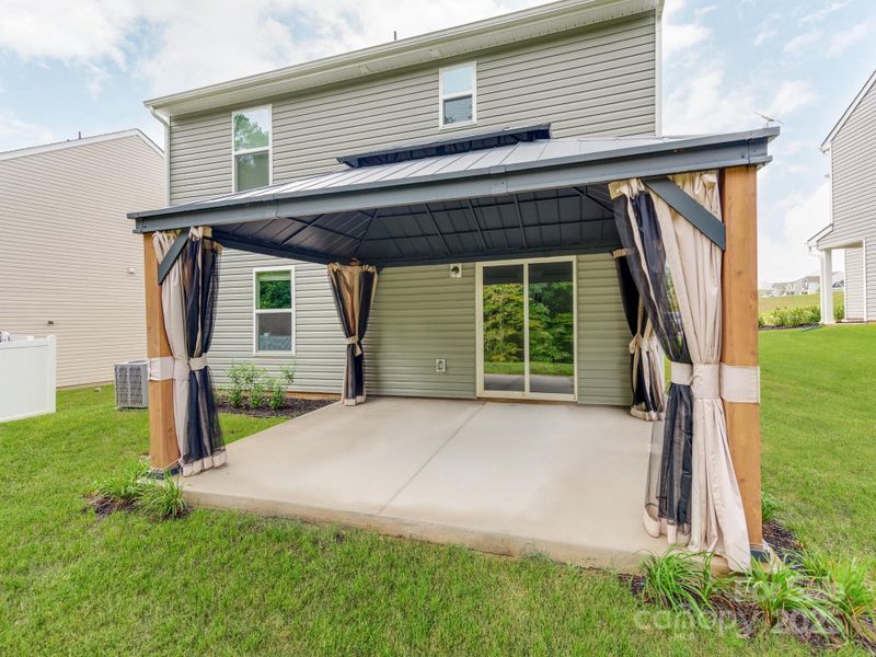 Front exterior of a new home in McKee Creek Village, Charlotte, NC, highlighting curb appeal (Image 2). Front exterior of a new home in McKee Creek Village, Charlotte, NC, highlighting curb appeal (Image 2).
