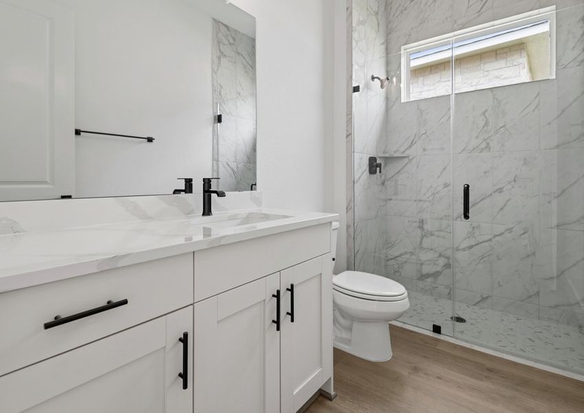 The secondary bath has a walk-in shower.