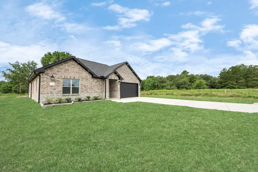 Front exterior of a new home in , Waller, TX, highlighting curb appeal (Image 2).