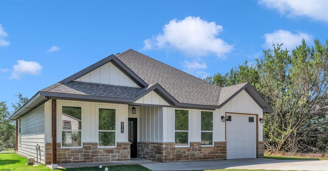 Front exterior of a new home in , Granbury, TX, highlighting curb appeal (Image 1). Front exterior of a new home in , Granbury, TX, highlighting curb appeal (Image 1).