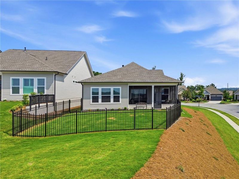 Exterior details and patio area of a home in The Retreat at Sterling on the Lake 48', Flowery Branch (Image 4).
