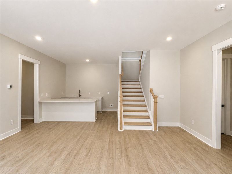 An open floorplan living area showcases a sleek ki