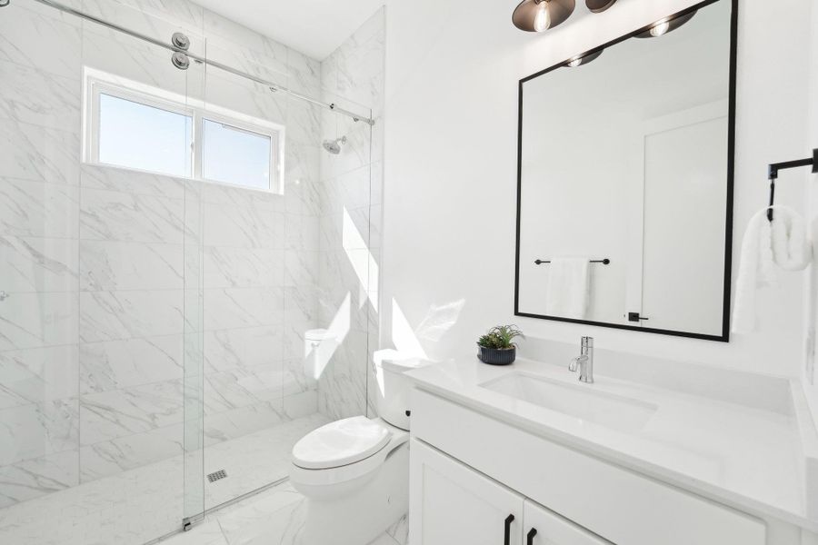 Elegant finishes and generous space define every bathroom in this home. Elegant finishes and generous space define every bathroom in this home.