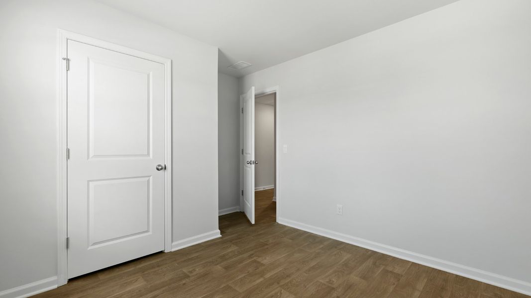 Spacious, unfurnished interior of a new home in Pine Hills at Cane Bay, Summerville (Image 13).