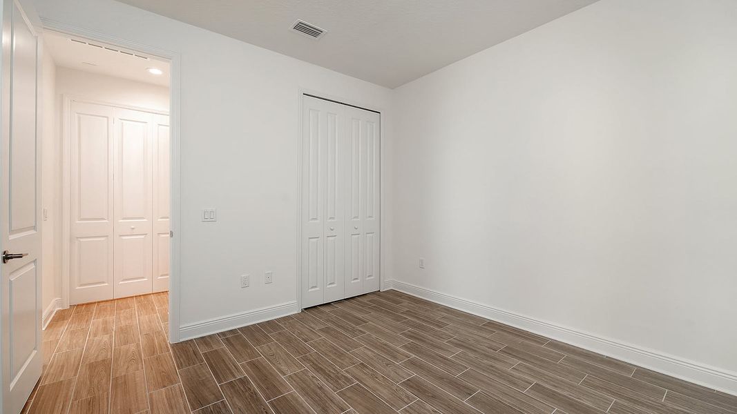 Spacious, unfurnished interior of a new home in Wildleaf Real Estate and Homes for Sale in Parrish, FL - Neal Communities, Parrish (Image 32). Spacious, unfurnished interior of a new home in Wildleaf Real Estate and Homes for Sale in Parrish, FL - Neal Communities, Parrish (Image 32).