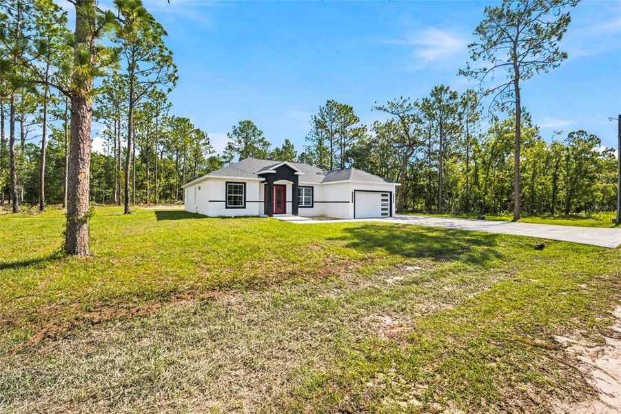 Front exterior of a new home in , Dunnellon, FL, highlighting curb appeal (Image 20). Front exterior of a new home in , Dunnellon, FL, highlighting curb appeal (Image 20).